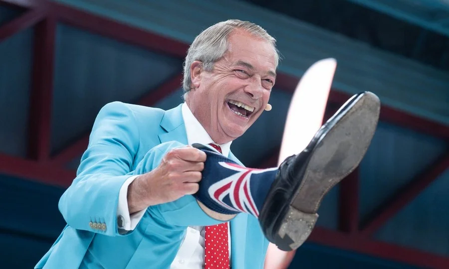 Nigel Farage speaking at podium